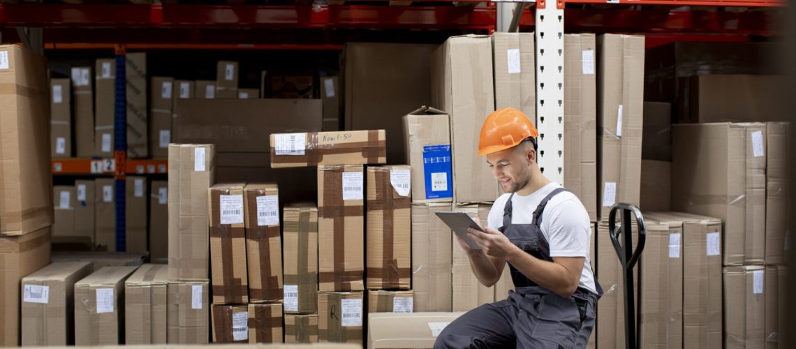 medium-shot-man-sitting-warehouse